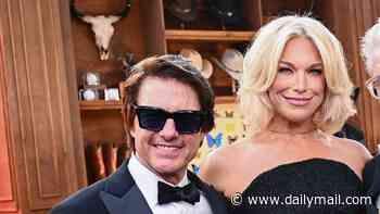 Hannah Waddingham gives Tom Cruise the Ted Lasso treatment as she tends to his new red hairdo during the Digger premiere in London