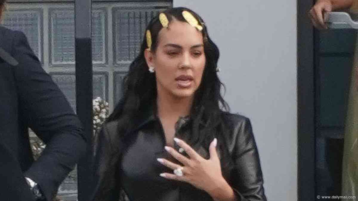 Georgina Rodriguez heads to Gucci Milan Fashion Week show wearing PVC mini suit with gold clips in her hair - 10 years after she met Cristiano Ronaldo while working in their store