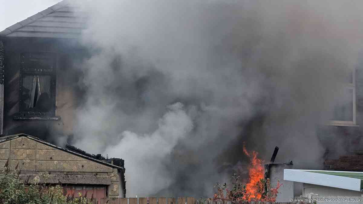 Man and dogs pulled from Leigh house blaze by firefighters as smoke billowed from property