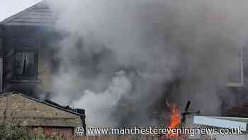 Man and dogs pulled from Leigh house blaze by firefighters as smoke billowed from property