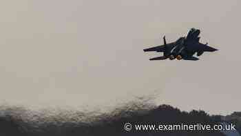 At least 13 dead after military plane crashes 'on residential plot'