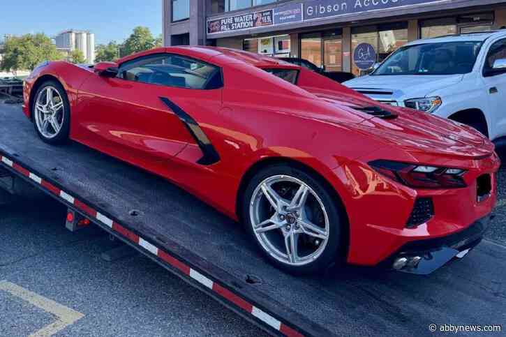Red Corvette zooms past unmarked RCMP patrol car near Vernon