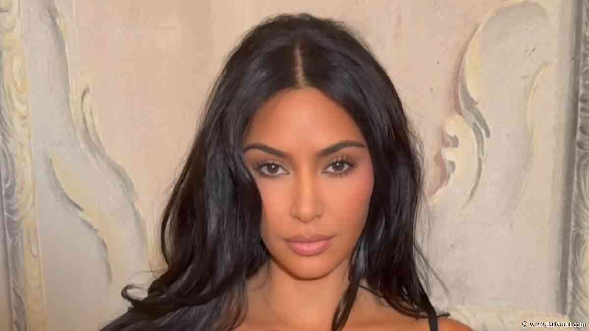 Kim Kardashian cozies up to boyfriend Lewis Hamilton before sharing romantic kiss in Paris... after revealing beau's bizarre nickname