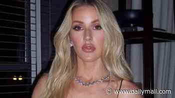 Ellie Goulding wows in a satin lace minidress as she poses for sexy snaps after fans branded her an 'icon' for simple response to Ed Sheeran row