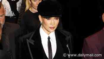 Jennifer Lopez channels Peaky Blinders as she sports baker boy hat and suit for Dolce & Gabbana's Milan Fashion Week show