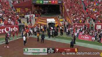 Top NFL prospect Dante Moore knocked out and loaded into ambulance as USC star slammed after sickening hit on Oregon QB