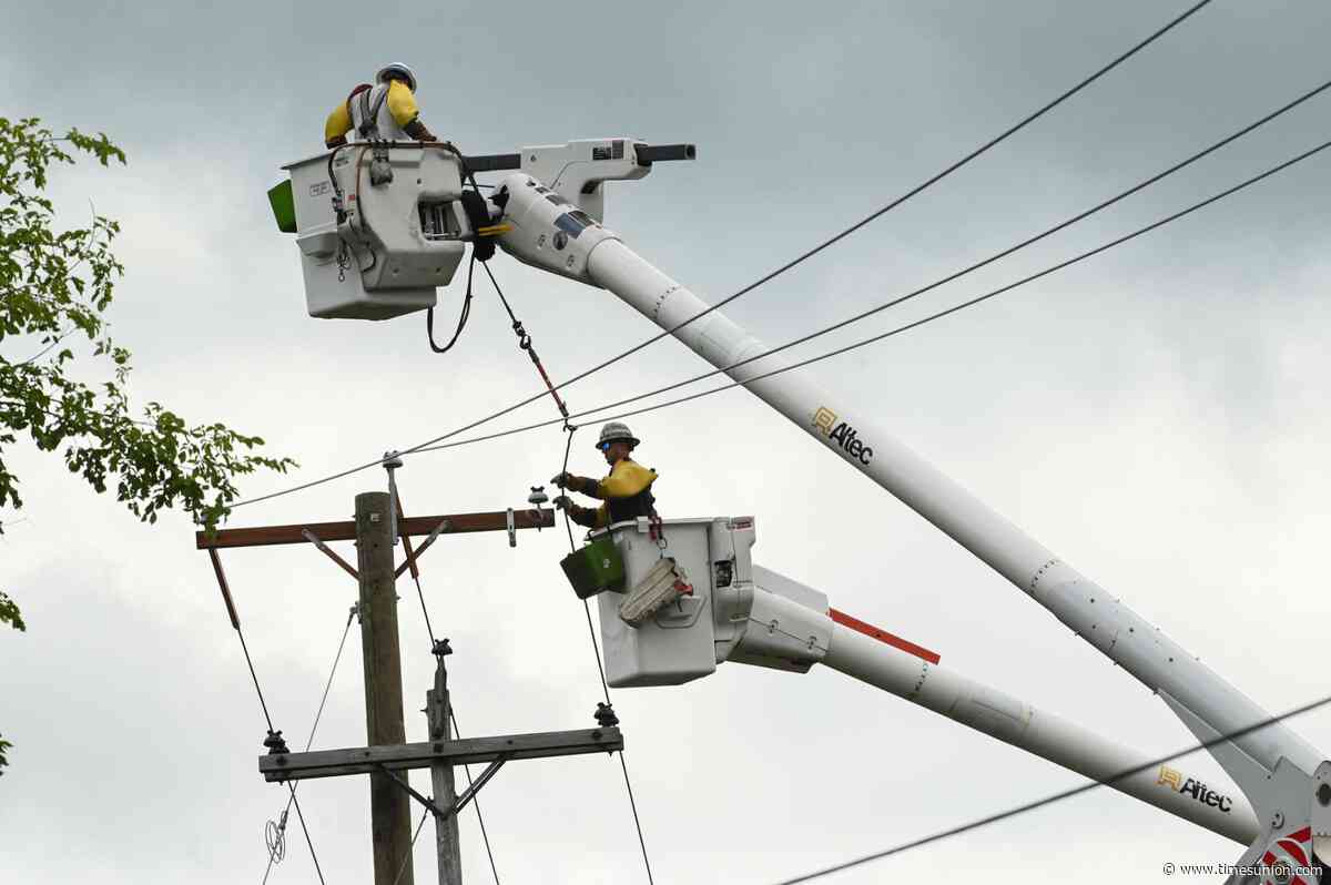 Crews work to restore power in storm likely to last until Tuesday