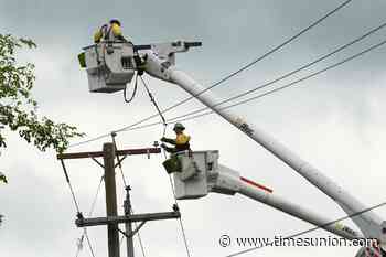 Crews work to restore power in storm likely to last until Tuesday