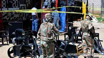 Manhunt launched after 13 men and four women killed in South Africa: Eight gunmen armed with 'AK-47 rifles and pistols' open fire at bar