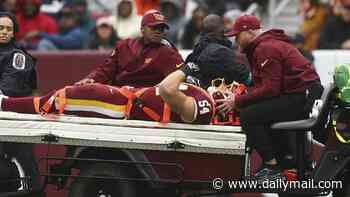 Terrifying moment Commanders star is carted off with neck injury after taking knee to head against Seahawks
