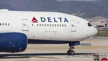 Four people are rushed to hospital after packed Delta Airlines jet was forced to make emergency landing over smoke in cabin