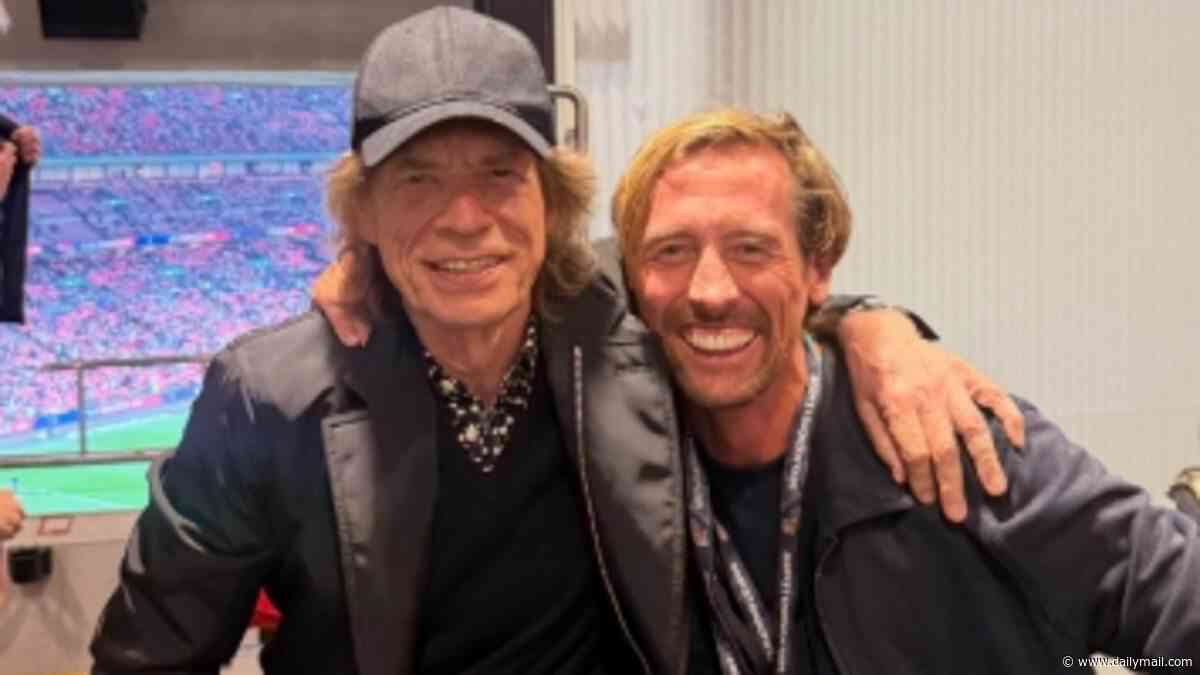 Peter Crouch fan girls over Mick Jagger as he catches a selfie with the Rolling Stones legend in private box at England game