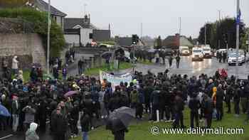 Tense stand-off in Ulster as thousands of protesters attend first loyalist parade for three decades 
