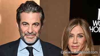 Jennifer Aniston gives glimpse of low-key life with boyfriend Jim Curtis as he dotes on her beloved dogs