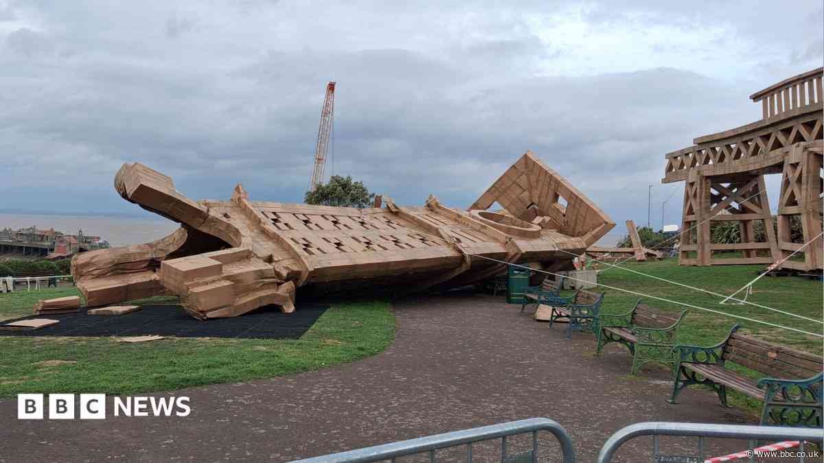 Cardboard tower sculpture toppled after wind hits