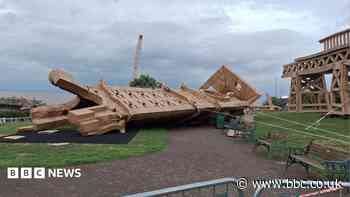 Cardboard tower sculpture toppled after wind hits