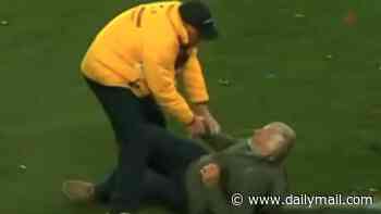 AFL star's dad gets flattened by MCG security as he tries to celebrate Brisbane's grand final win with his son