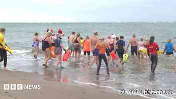 Sea dip goes ahead after pollution warning lifted
