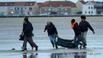 At least three UK-bound migrants are killed and dozens more severely injured as mega-dinghy capsizes off Calais
