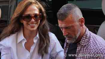 Jennifer Lopez holds hands with her hunky silver fox bodyguard as she nearly gets mobbed in Italy