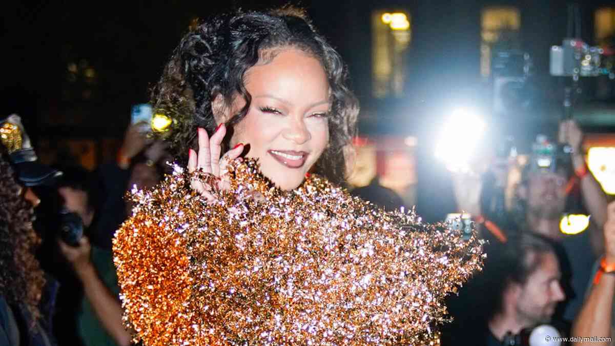 Rihanna commands attention in a garish blood orange co-ord as she arrives at Matières Fécales show during Paris Fashion Week