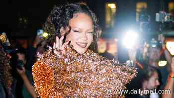 Rihanna commands attention in a garish blood orange co-ord as she arrives at Matières Fécales show during Paris Fashion Week