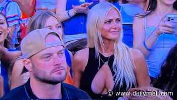 Stunning college football fan who went viral on ESPN at Florida game outs herself on social media to send her fame skyrocketing