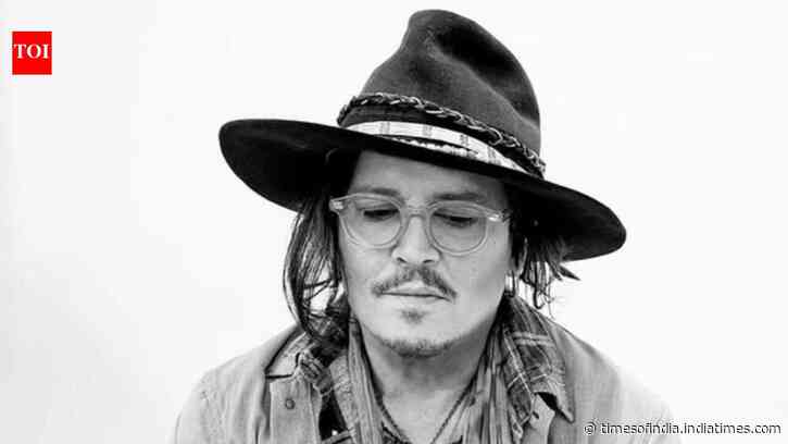 Johnny Depp takes a bite of fake plants at a party in Las Vegas