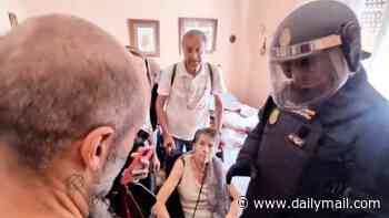 Spanish pensioner, 87, is allowed to return home after she was evicted by riot cops after investment brothers pushed her rent up by 275%, sparking nationwide fury