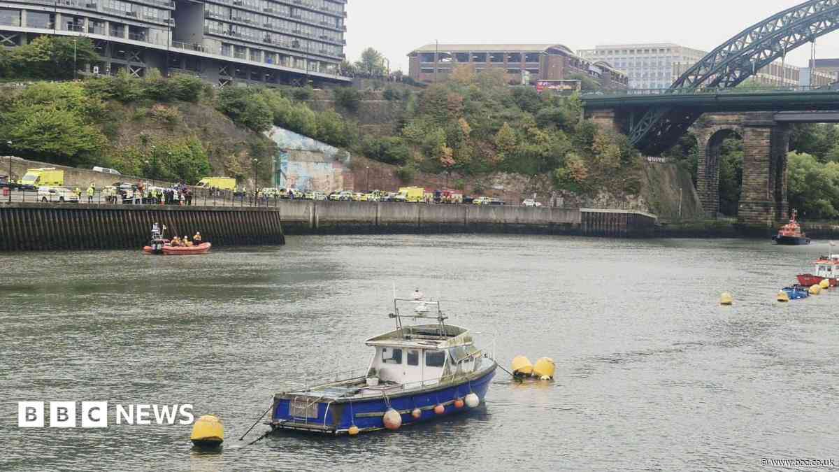 Car enters river prompting large emergency response