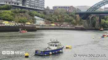 Car enters river prompting large emergency response