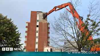 Giant machine tears down city centre office block