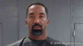 Two-time NBA champion arrested on family violence charge in Texas as stone-faced mugshot surfaces