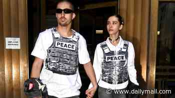 Gorgeous couple arrested for scaling the Empire State Building wear VERY eye-catching outfits at latest court appearance