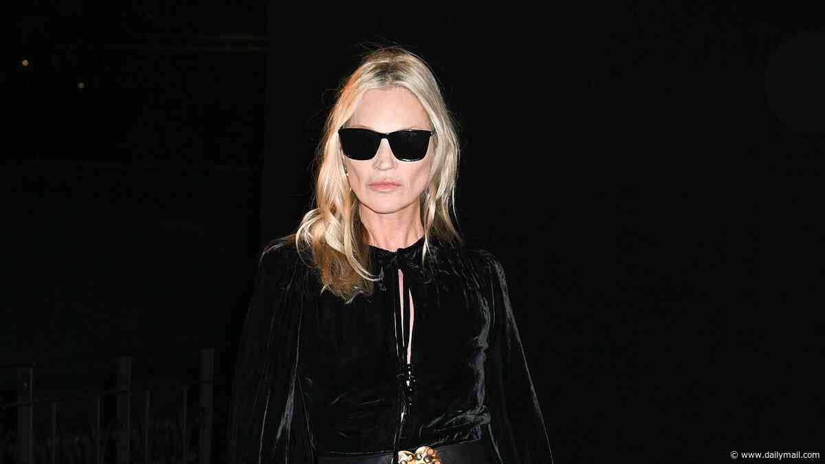 Kate Moss looks glamorous in a black velvet maxi dress as she joins daughter Lila and Rosie Huntington-Whiteley for the Saint Laurent show during Paris Fashion Week