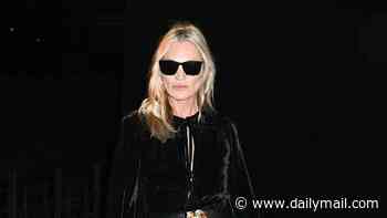 Kate Moss looks glamorous in a black velvet maxi dress as she joins daughter Lila and Rosie Huntington-Whiteley for the Saint Laurent show during Paris Fashion Week