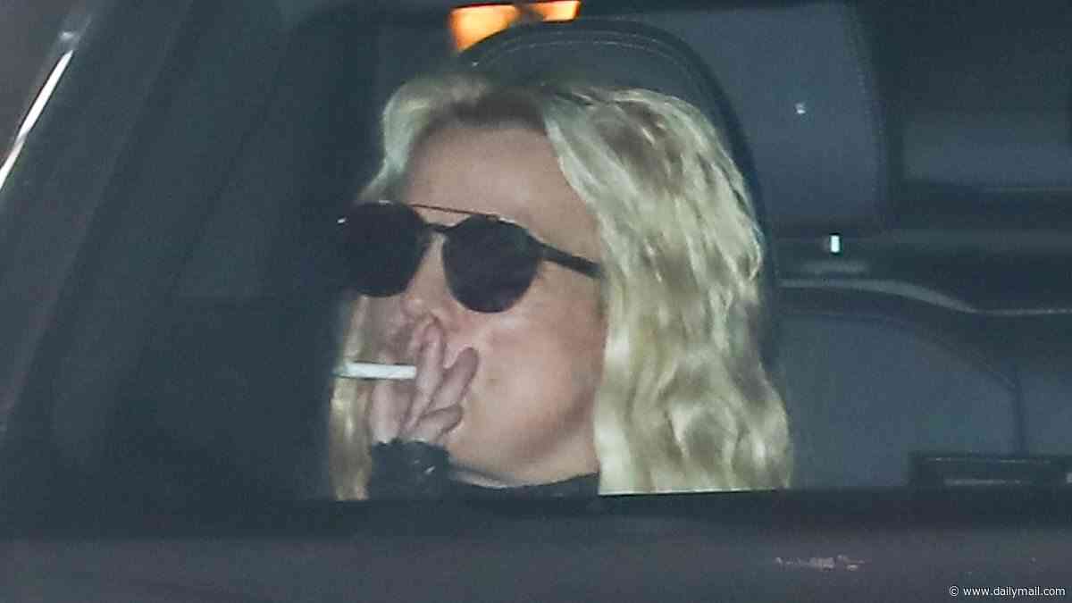 Smoking Britney Spears resurfaces at Malibu hotspot as she sticks to the passenger seat... seven months after DUI arrest