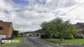 Man arrested after woman's body found in village