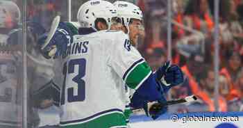 Cotter, Canucks outlast Oilers 6-5 in overtime