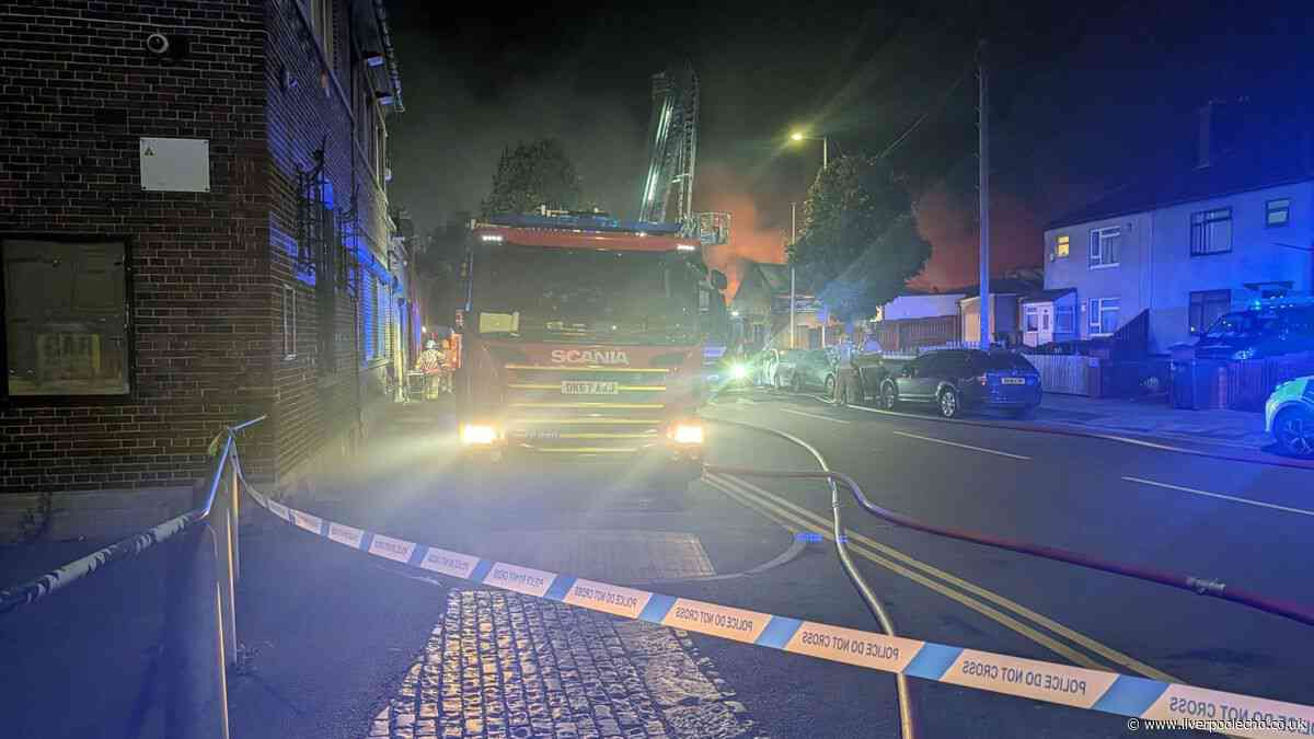 Bootle garage fire live as road remains closed