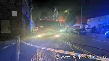 Bootle garage fire live as road remains closed