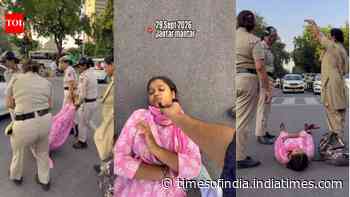 Woman lies down at Delhi traffic signal, refuses to move until Vijay Thalapathy hugs her
