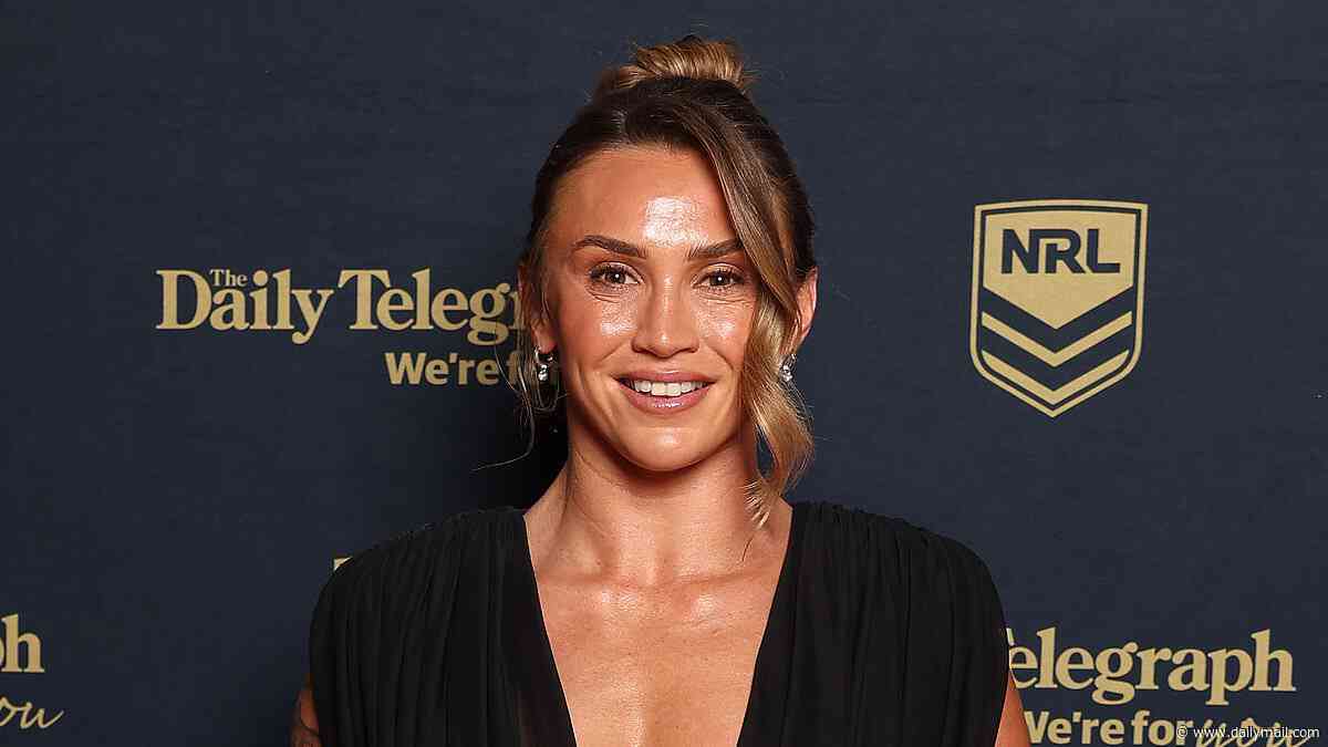 Brisbane Broncos player Julia Robinson shows off her elaborate tattoos and risks a wardrobe malfunction in very daring plunging gown at the Dally M Awards