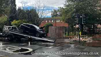 Firefighters rescue woman after car ploughs into Chorlton wall