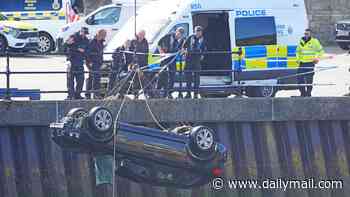 Car that plunged into River Wear and killed three teenagers is pulled from water after driver 'who was in the wrong gear' crashed through metal barrier