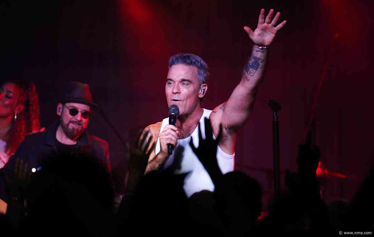 Watch Robbie Williams surprise fans with impromptu street performance in Buenos Aires