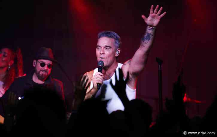 Watch Robbie Williams surprise fans with impromptu street performance in Buenos Aires