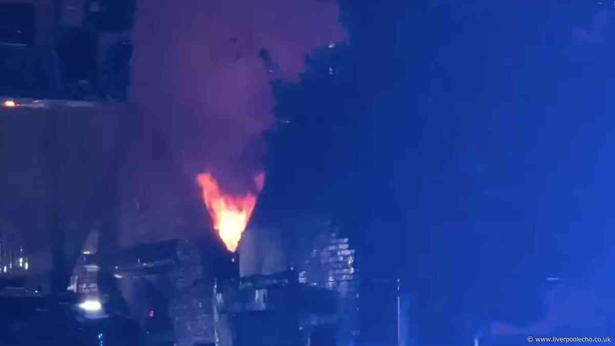 Two men arrested after Bootle warehouse goes up in flames