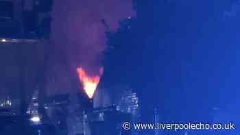 Two men arrested after Bootle warehouse goes up in flames