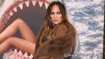 Jennifer Lopez wraps up in brown faux fur shawl while Miranda Kerr makes a statement in a very cheeky £300 top as she arrives at Stella McCartney's Paris Fashion Week showcase